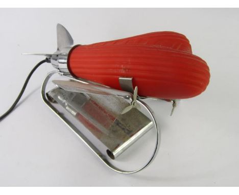 A unusual retro style chrome plated and orange glass lamp, modelled in the form of an aeroplane, possibly 1960's, 31cm  long.