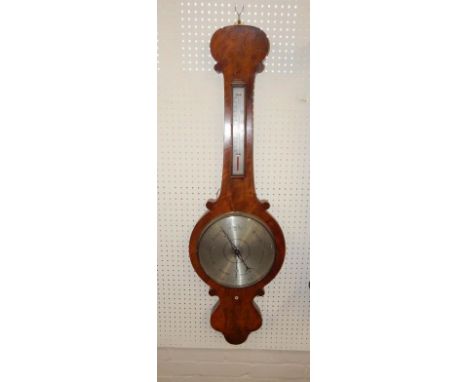 A Victorian walnut wheel barometer, with a silvered dial and thermometer, 102cm high.