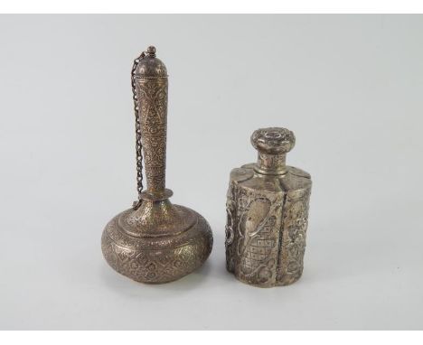 A Continental white metal tea caddy, of lobed form embossed with flowers and shields, stamped 800, 4.12oz, and an Indian whit