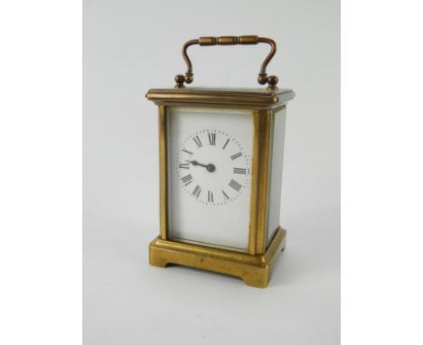 A Richard & Co brass cased carriage clock, enamel dial bearing Roman numerals, single barrel movement, with key, 8cm x 6.5cm 
