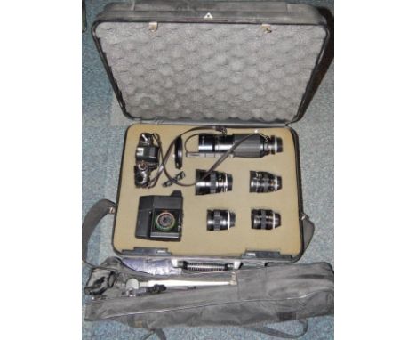 A Minolta XE-1 camera with flash, telephoto lens, four further lenses, cased, together with a Velbon camera tripod, cases, (2