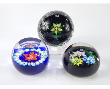 A Selkirk faceted cut glass paperweight, circa 1983, decorated with a flower within a latticino border, Caithness miniature p