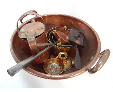 A large copper two handled pan and other brass and copper, including three copper saucepans, brass chamber candlestick, coppe
