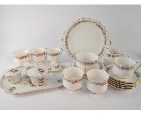 A Paragon porcelain part tea service decorated in the Belinda pattern, comprising bread plate, cream jug, sugar bowl, six cup