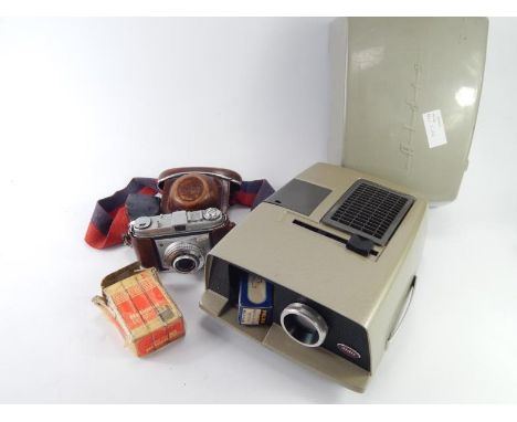 A Kodak Retinette 35mm camera, Aldis 35mm projector, flash gun, etc.