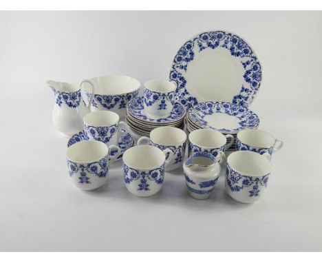 A Foley late 19thC part tea service, decorated in blue and white with flowers, comprising bread plate, cream jug, sugar bowl,