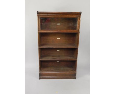 An early 20thC Globe Wernicke oak four tier bookcase, with copper mounts, one glazed door, (AF), 87cm wide.