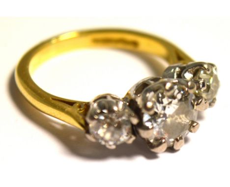 An 18ct yellow gold three stone diamond ring, the circular cut stone weighing approx 1ct flanked by twin further diamonds, in