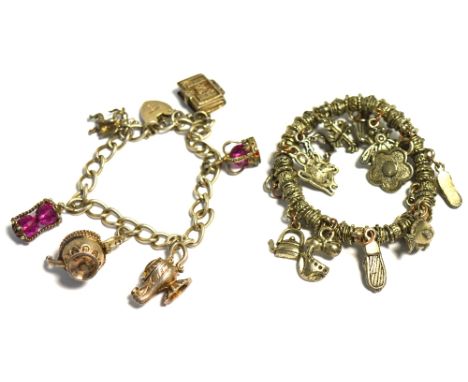 A hallmarked silver charm bracelet to include charms in the form of Aladdin's lamp, a teapot, crown, Cupid, a bible etc and o
