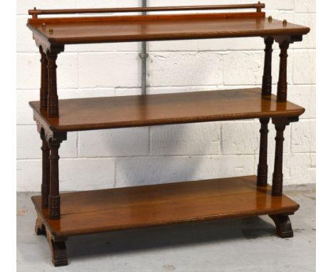 A c.1900 three tier oak buffet with ring turned supports, width 122cm.