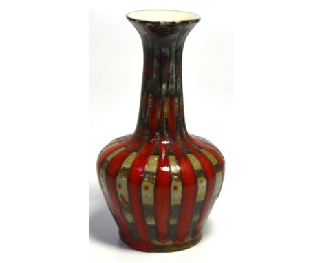 A Corbridge baluster vase with red and brown abstract pattern, printed and impressed marks to the base, height 16cm.