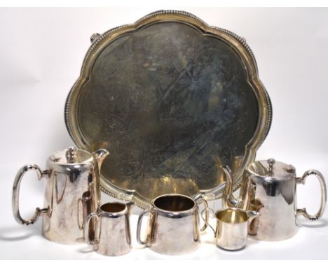 A plated tray on scrolling supports and bead rim, also a tea service comprising tea pot, hot water jug, milk, sugar and cream