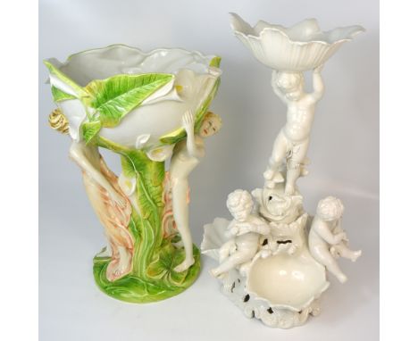 A Continental ceramic jardinière, the stem and top decorated with scrolling lilies and a pair of scantily clad females, heigh