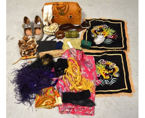 A quantity of vintage textiles to include leather bags, an Art Deco pale green velvet clutch bag, Chinese cushion covers, lea
