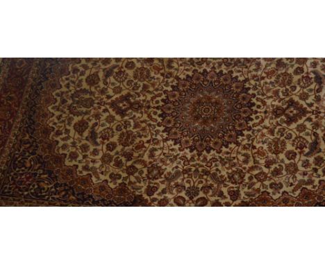 A beige ground Keshan style carpet, 230 x 160cm.