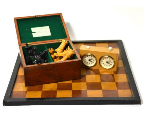 A carved Staunton chess set in walnut case, the rook with printed emblem to the top, the base of the king printed "Jacques Lo