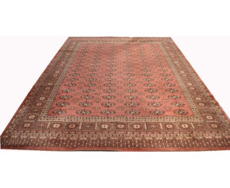 A large salmon pink ground pure wool carpet, approx 340 x 250cm.
