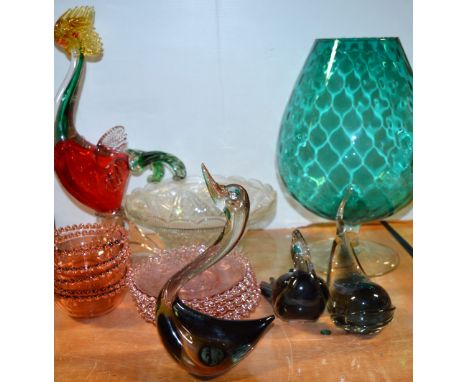 A collection of retro glassware to include a large turquoise decorative brandy glass, a Murano style cockle, a dolphin, a swa