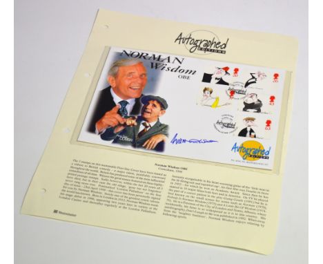 A collection of first day cover stamps commemorating comedians and signed by Norman Wisdom.