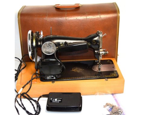 A vintage cased Singer sewing machine.