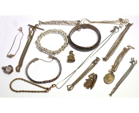 A quantity of silver and white metal jewellery to include a silver locket on a chain, a heart pendant, a silver bangle, a whi