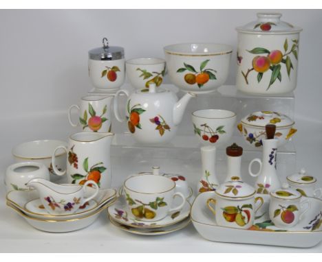 A quantity of Royal Worcester "Evesham" dinnerware and teaware to include dishes, a milk jug, an oil jug, a biscuit barrel, s