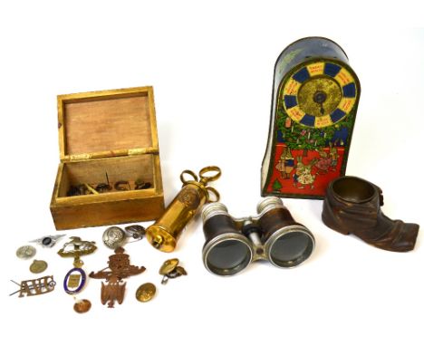 A box containing various military buttons and badges, a Moor & Sons brass syringe, an inkwell in the form of a wooden boot, a