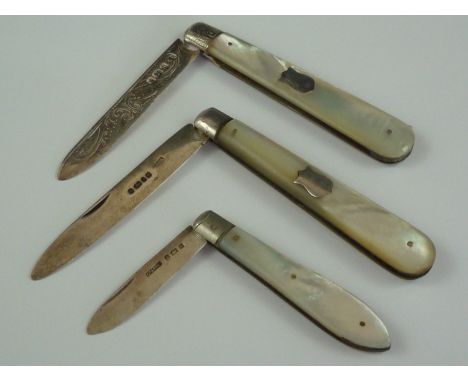 Three Victorian and later folding silver fruit knives with mother of pearl grip scales, one having a foliate engraved blade