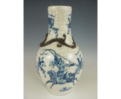 A Chinese crackle-ware blue and white stoneware baluster vase, decorated with a continuous battle scene, on the shoulders of 