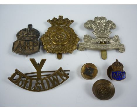 A small group of British Army insignia and an escape and evasion compass, including a Duke of Lancaster's Own Yeomanry brass 