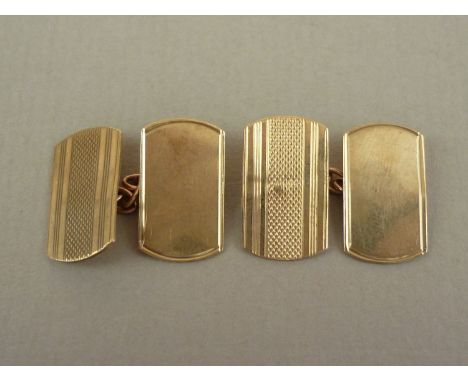 A gentleman's pair of 9ct gold cuff links, of rounded rectangular form with engine turned banded decoration to the face, 3g
