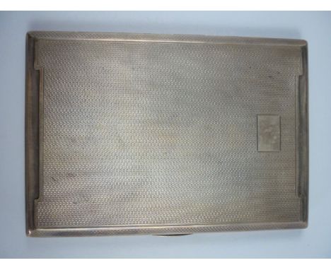 An Elizabeth II silver cigarette case, of slender rectangular form with canted corners and engine turned decoration, Adie Bro
