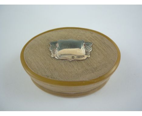 A 19th Century Scottish horn snuff box, the lid bearing a vacant thistle-and-shield cartouche, the latter stamped CP and bear