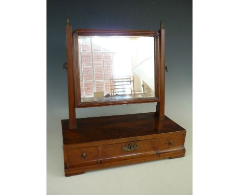 A George III mahogany swivel toilet mirror, 43 cm high 