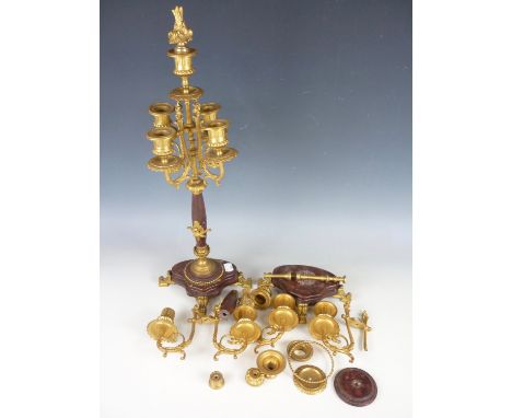 A pair of late 19th Century four branch five light candelabra in gilt brass and polished variegated red marble, (one badly da