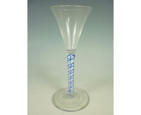 A George III coloured twist wine glass, of trumpet form, the stem having an opaque white corkscrew edged in blue, 15.5 cm. So