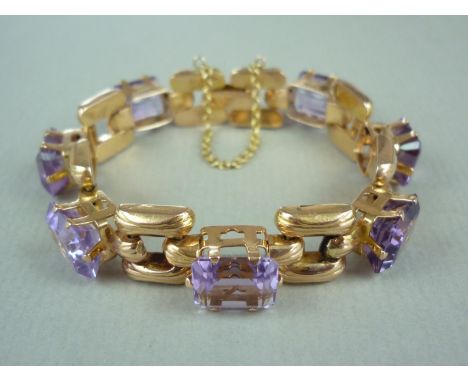 A high carat yellow metal and amethyst bracelet, comprising seven emerald-cut stones, each of approximately 4.06ct, crown set