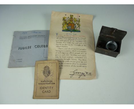 A small box containing Second World War shrapnel, fragments of aircraft wreckage, an ordnance fuse cap, together with related