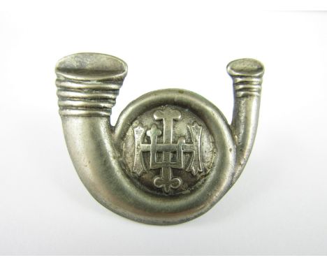 An HLI bugle badge