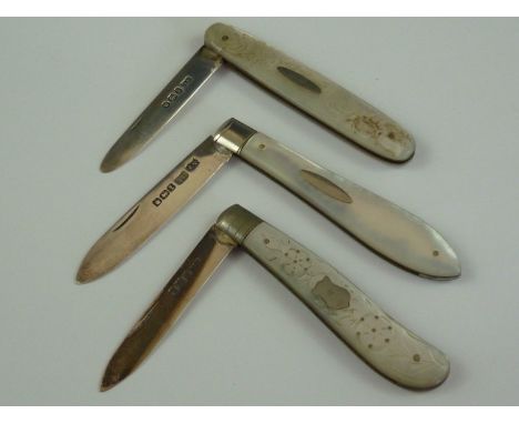 Three Victorian and later folding silver fruit knives with mother of pearl grip scales, two with engraved decoration to the l