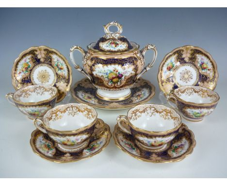 An early 19th Century Rockingham type part tea set, comprising sucrier, four tea cups and saucers and a cake plate, hand enam