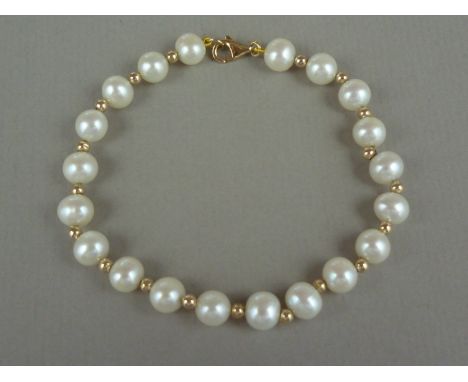 A high carat yellow metal and pearl bracelet, the pearls interspersed by a yellow metal pellet, clasp marked 14ct, tests as g