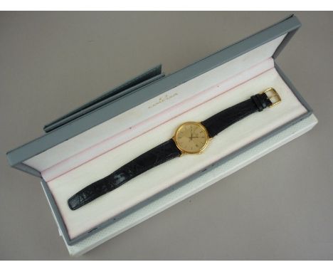 An Omega 18ct gold cased wristwatch, having quartz movement, circular face, brushed dial, baton markers and calendar aperture