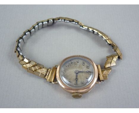 An inter-War lady's 9ct gold cased Rolex wristlet watch, having crown wound 15 jewel lever movement, radially engine turned a