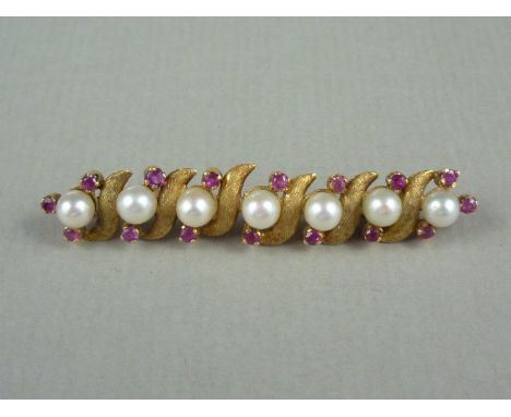 A ruby, pearl and high carat yellow metal bar brooch, in an alternating arrangement of single pearls flanked by claw set rubi