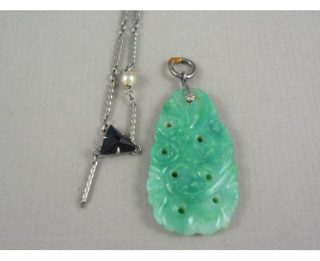 An early 20th Century Art Deco precious white metal necklace (a/f), tests as platinum, together with a carved jade pendant, n