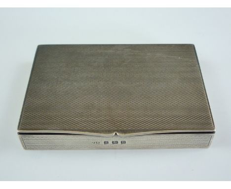 A George V silver snuff box, bearing engine-turned decoration overall, the interior gilt, John Rose, Birmingham, 1935, 75 x 5
