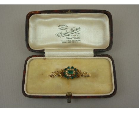 An early Victorian green stone and pearl bar brooch, with central flowerhead arrangement comprising single collet and pellet-