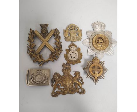 Collection of cap badges and helmet plates with examples to include a Victorian Coldstream Guards helmet plate, British Army 