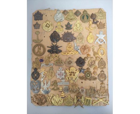 Militaria Interest. Tray containing a large quantity of cap badges with regiments to include South African Heavy Artillery, R